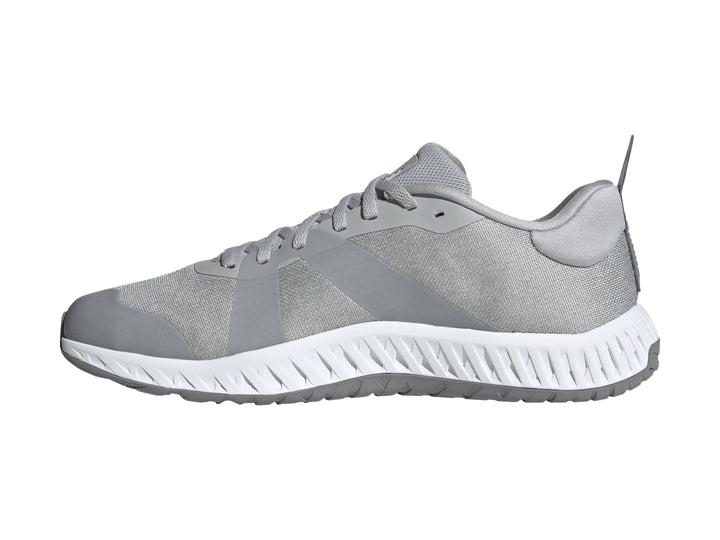 Tenis deportivos Adidas en color gris con franjas blancas y suela blanca Dual Density.