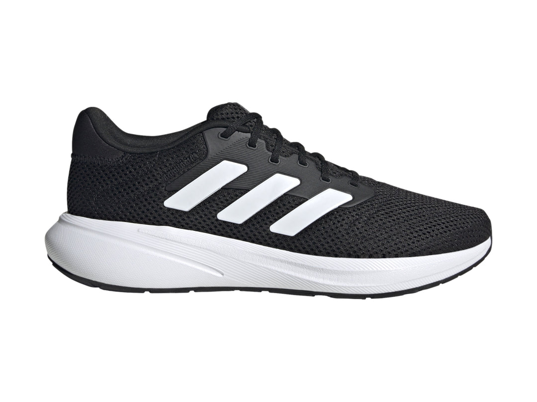 Tenis deportivos Adidas Response Runner color negro con suela y franjas laterales blancas.