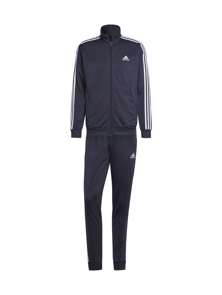 Conjunto deportivo Adidas azul marino con rayas blancas laterales en chaqueta y pantalón.
