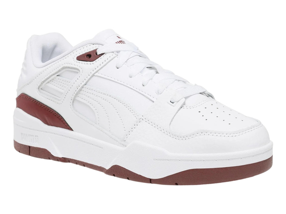 Tenis PUMA Slipstream de cuero color blanco con detalles en marrón oscuro en la suela y el lateral.