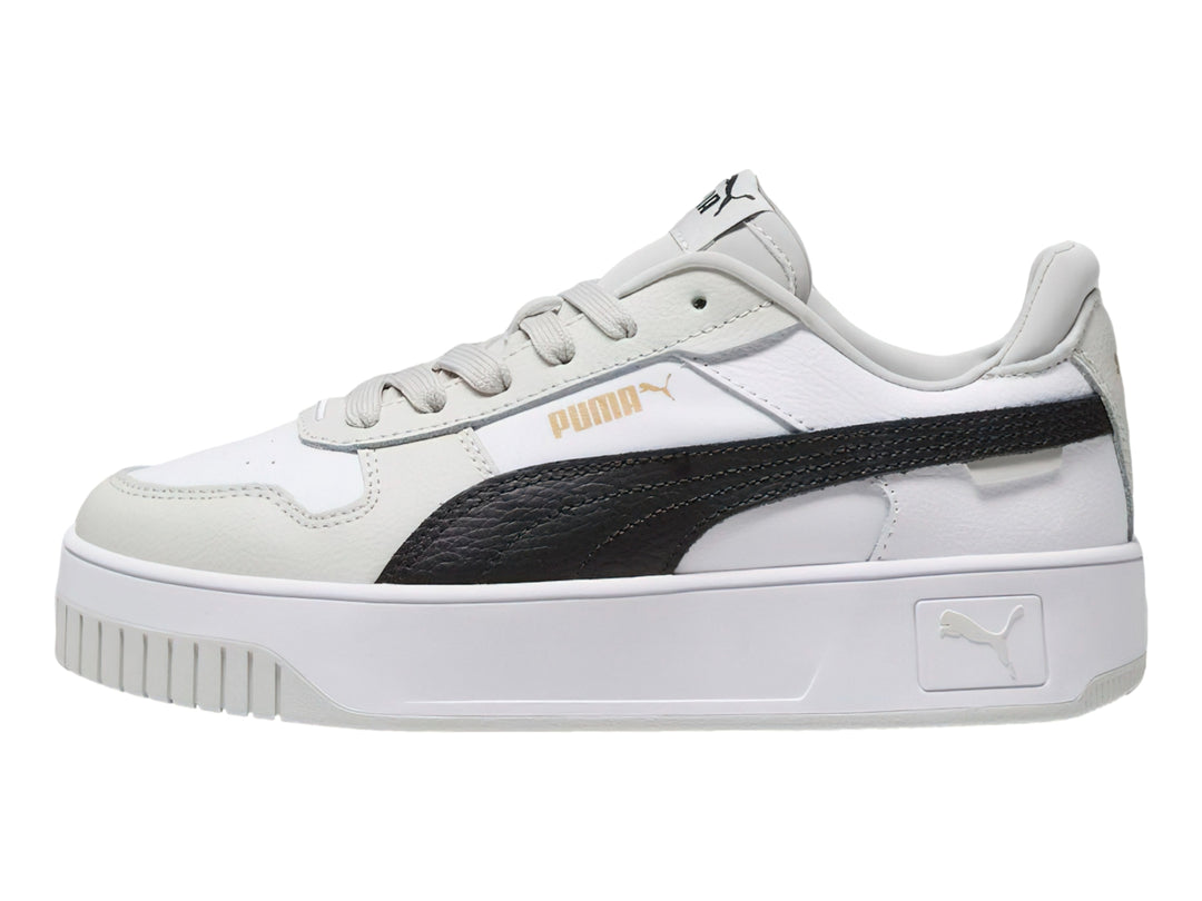 Tenis PUMA Carina Street blancos con franja negra y detalles en gris, con suela de plataforma.
