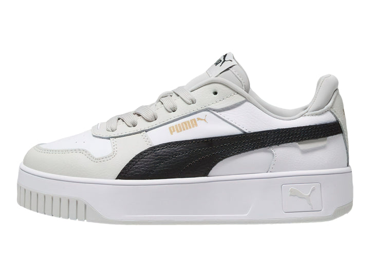 Tenis PUMA Carina Street blancos con franja negra y detalles en gris, con suela de plataforma.