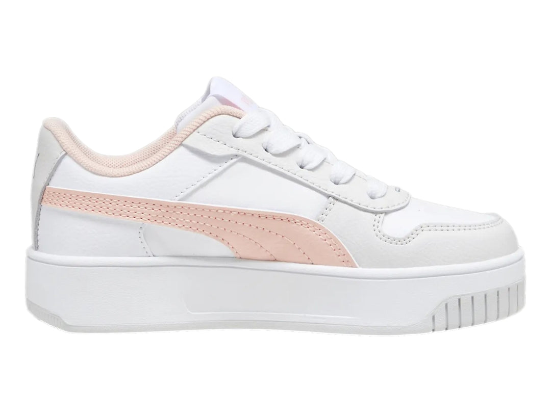 Tenis PUMA Carina Street para niña en color blanco con detalles en rosa y suela de plataforma blanca.