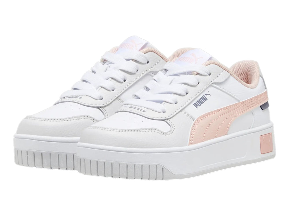 Tenis PUMA Carina Street para niña en color blanco con detalles en rosa y suela de plataforma blanca.
