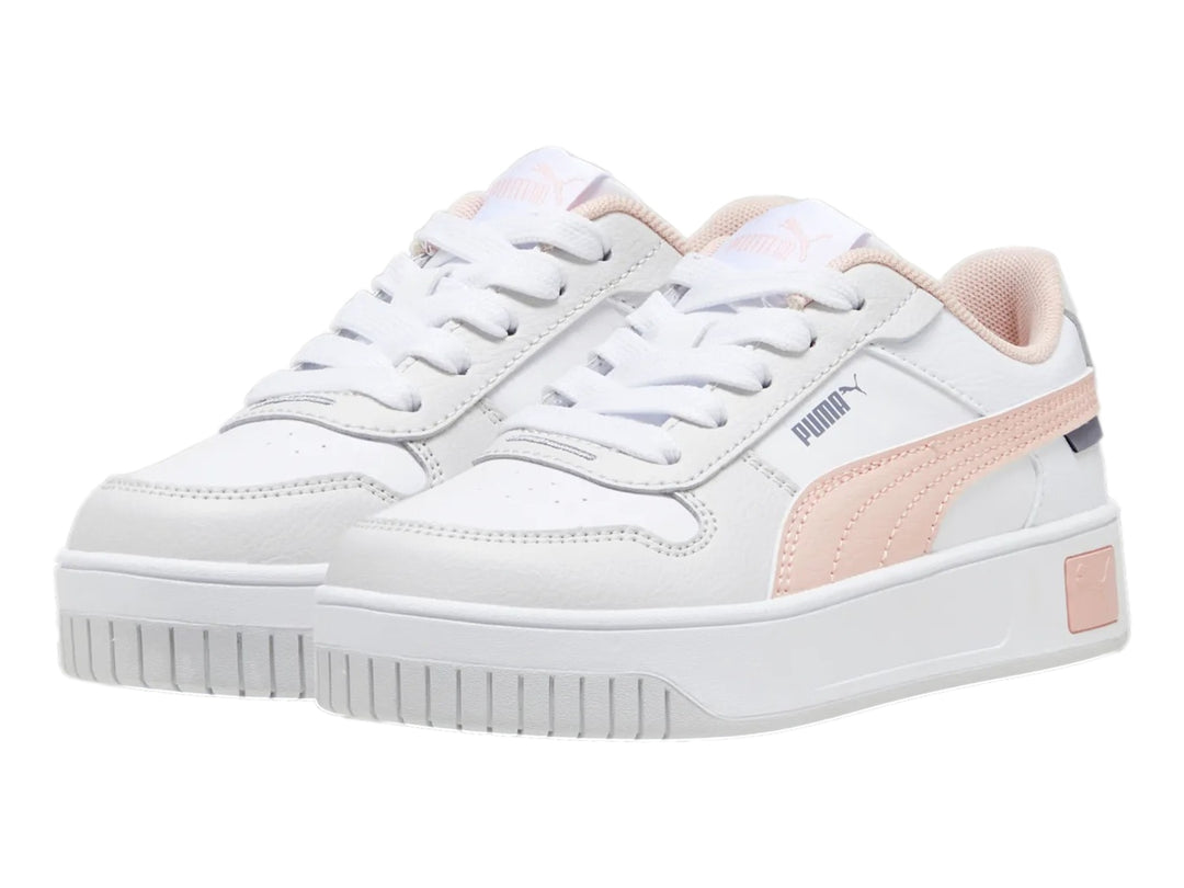 Tenis PUMA Carina Street para niña en color blanco con detalles en rosa y suela de plataforma blanca.