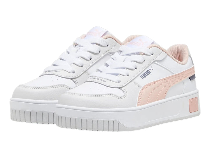 Tenis PUMA Carina Street para niña en color blanco con detalles en rosa y suela de plataforma blanca.