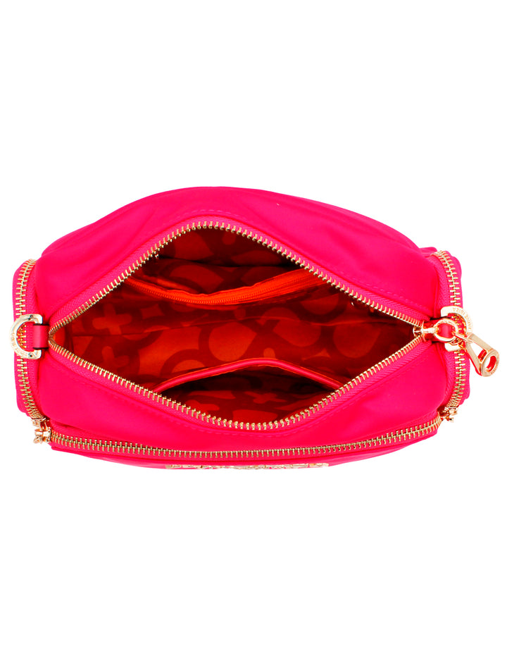 Neceser rosa de la marca Jaime Ibiza con cierres dorados y logotipo frontal.