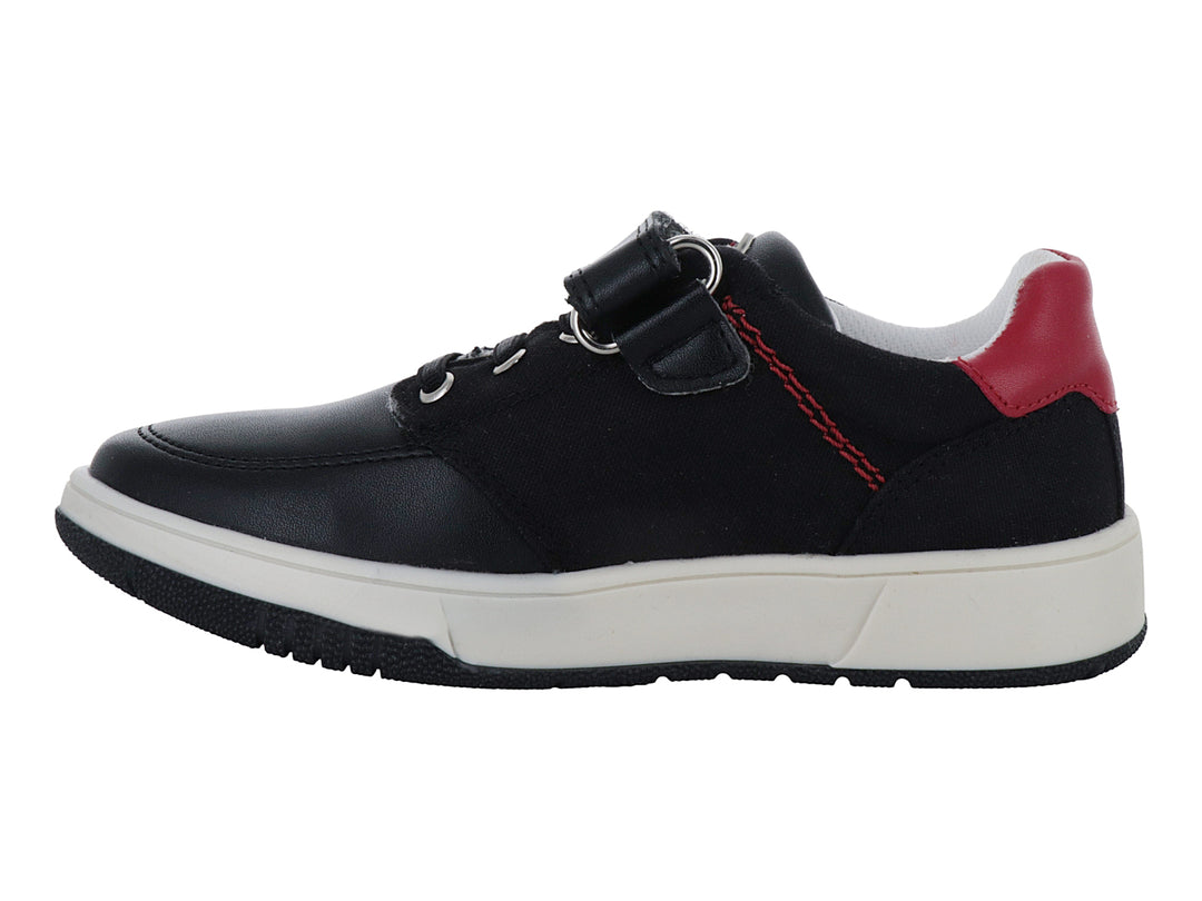Zapato infantil marca Elefante en color negro con detalles blancos y rojos, cierre de velcro y agujetas.