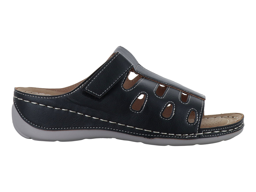 Sandalia Comfort Fit color negro con costuras blancas decorativas y correa ajustable en el empeine.