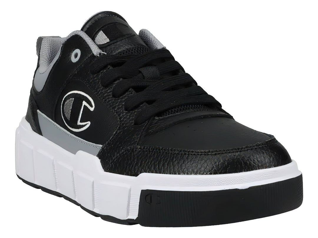 Tenis Champion Drome Ventor Lo color negro con detalles en gris y suela blanca gruesa.
