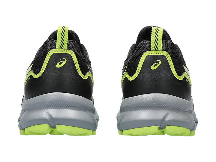 Tenis deportivos ASICS Trail Scout color negro con detalles en verde lima y suela gris.