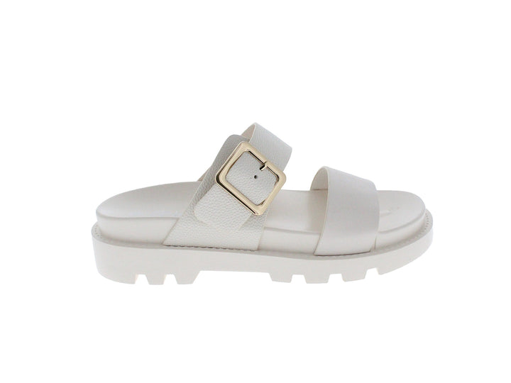 Sandalia beige de plataforma con suela track y hebilla dorada.