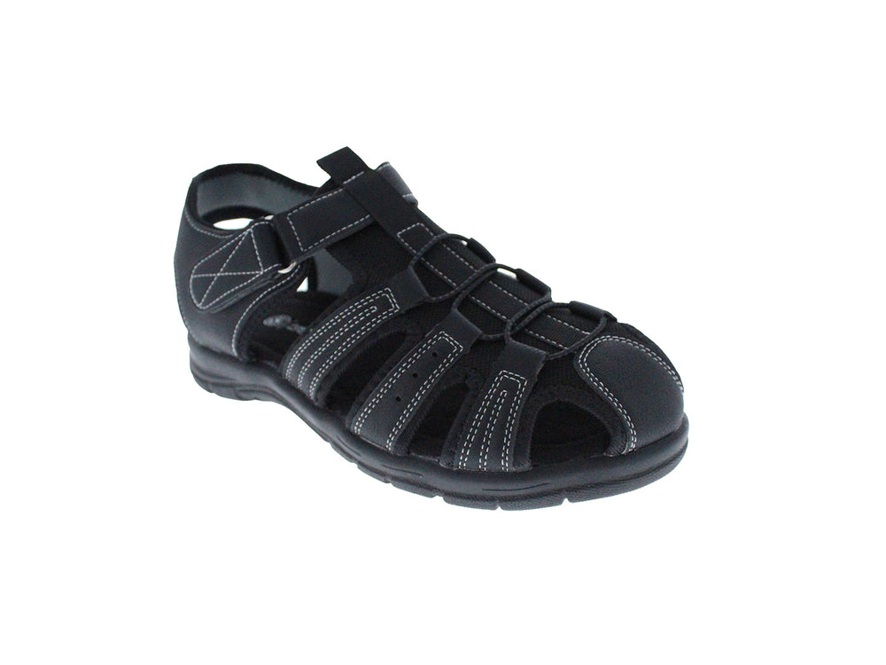 Sandalia cerrada color negro para niño con costuras blancas y cierre de velcro.