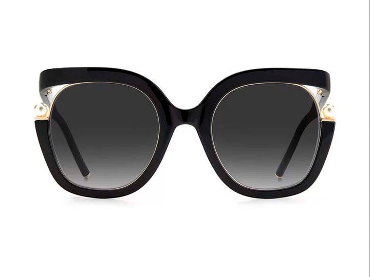 Lentes de sol Carolina Herrera negros con montura ancha, cristales degradados y detalles laterales en dorado.