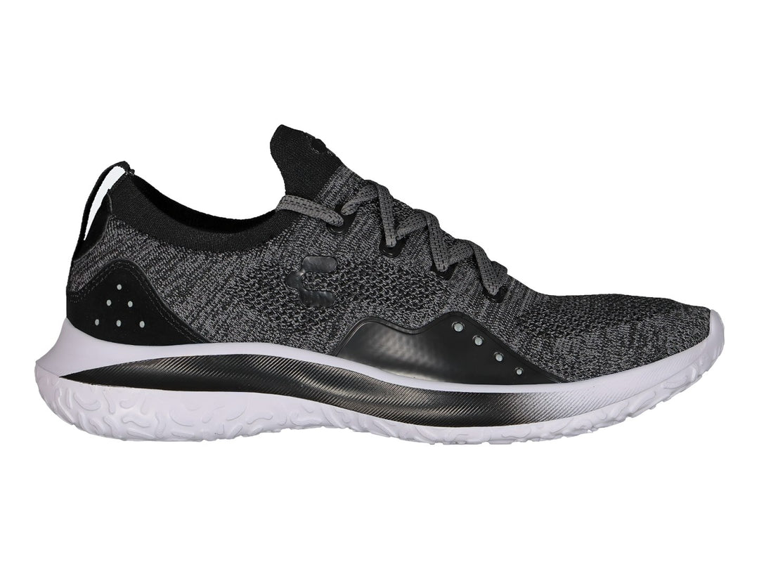 Tenis deportivos Charly color negro con tejido transpirable y suela blanca.