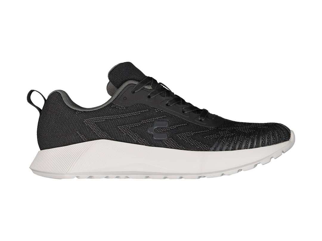 Tenis deportivos Charly en color negro con suela blanca y tejido transpirable.