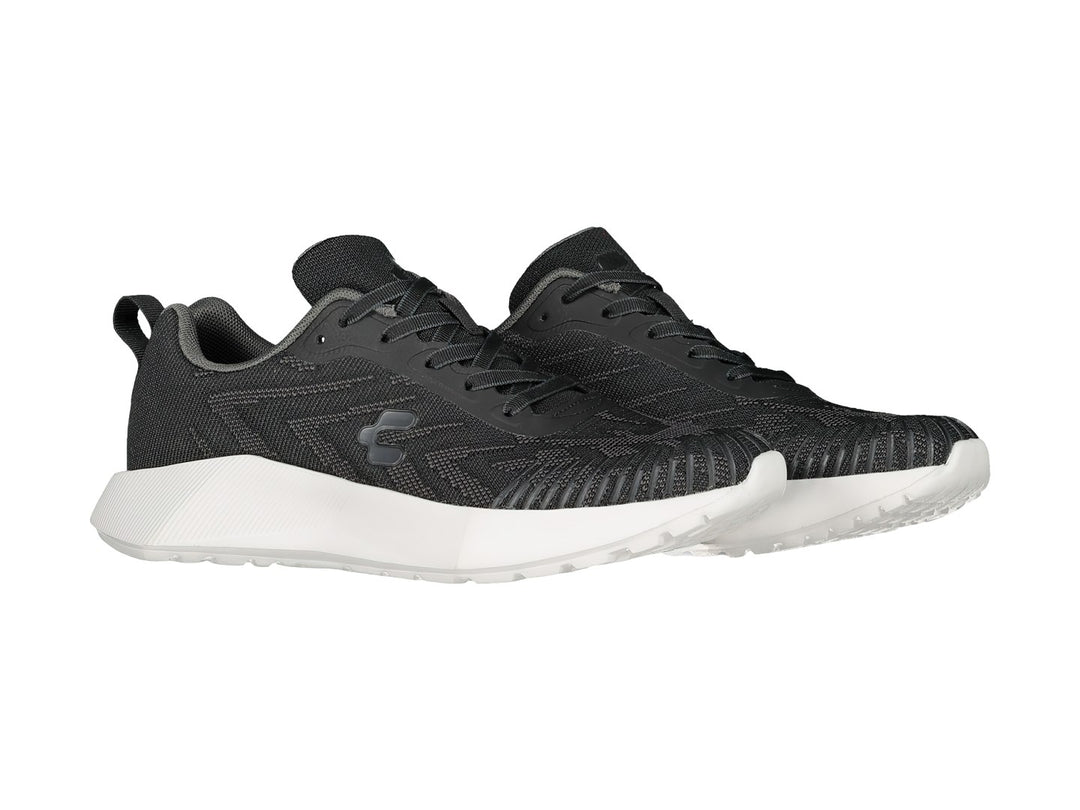 Tenis deportivos Charly en color negro con suela blanca y tejido transpirable.