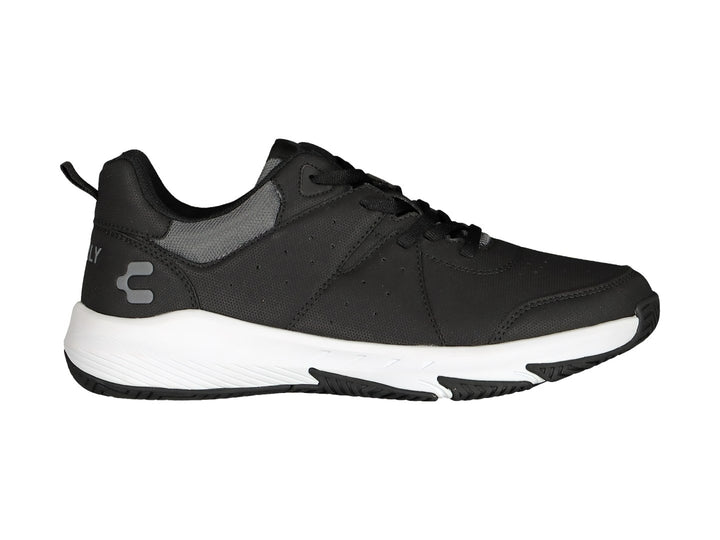 Tenis deportivos Charly color negro con suela blanca.
