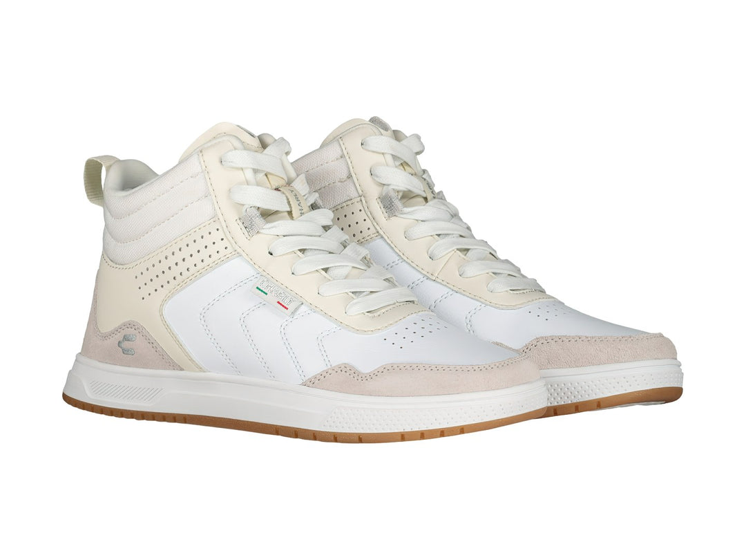 Tenis deportivos Charly color blanco y beige con suela color caramelo.