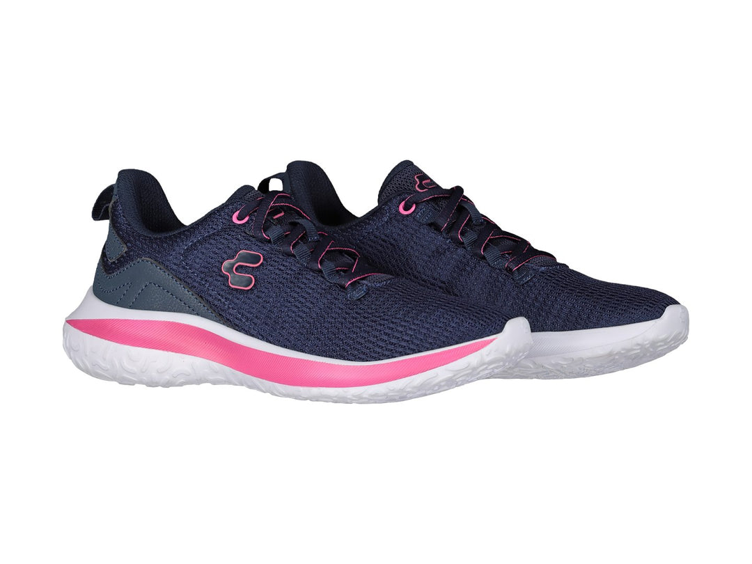 Tenis deportivos Charly color azul marino con franja rosa y suela blanca.