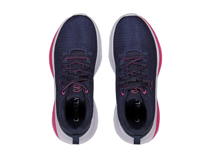 Tenis deportivos Charly color azul marino con franja rosa y suela blanca.