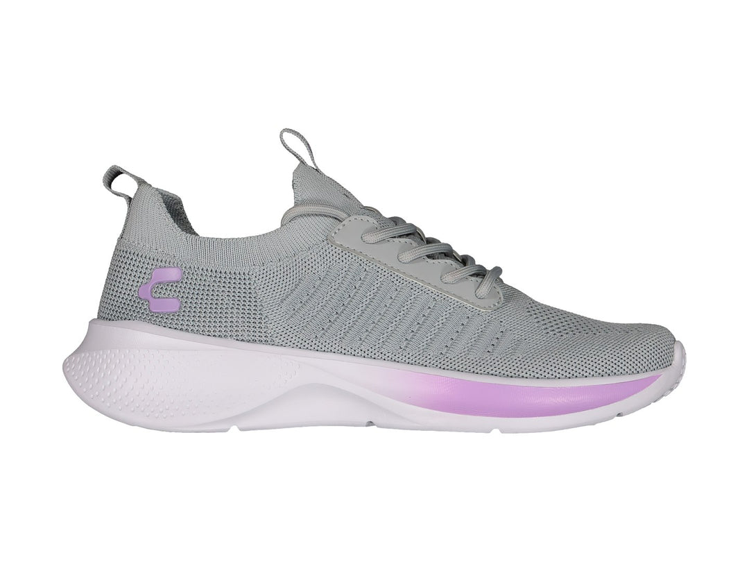 Tenis deportivos Charly color gris con detalles en lila y suela blanca.