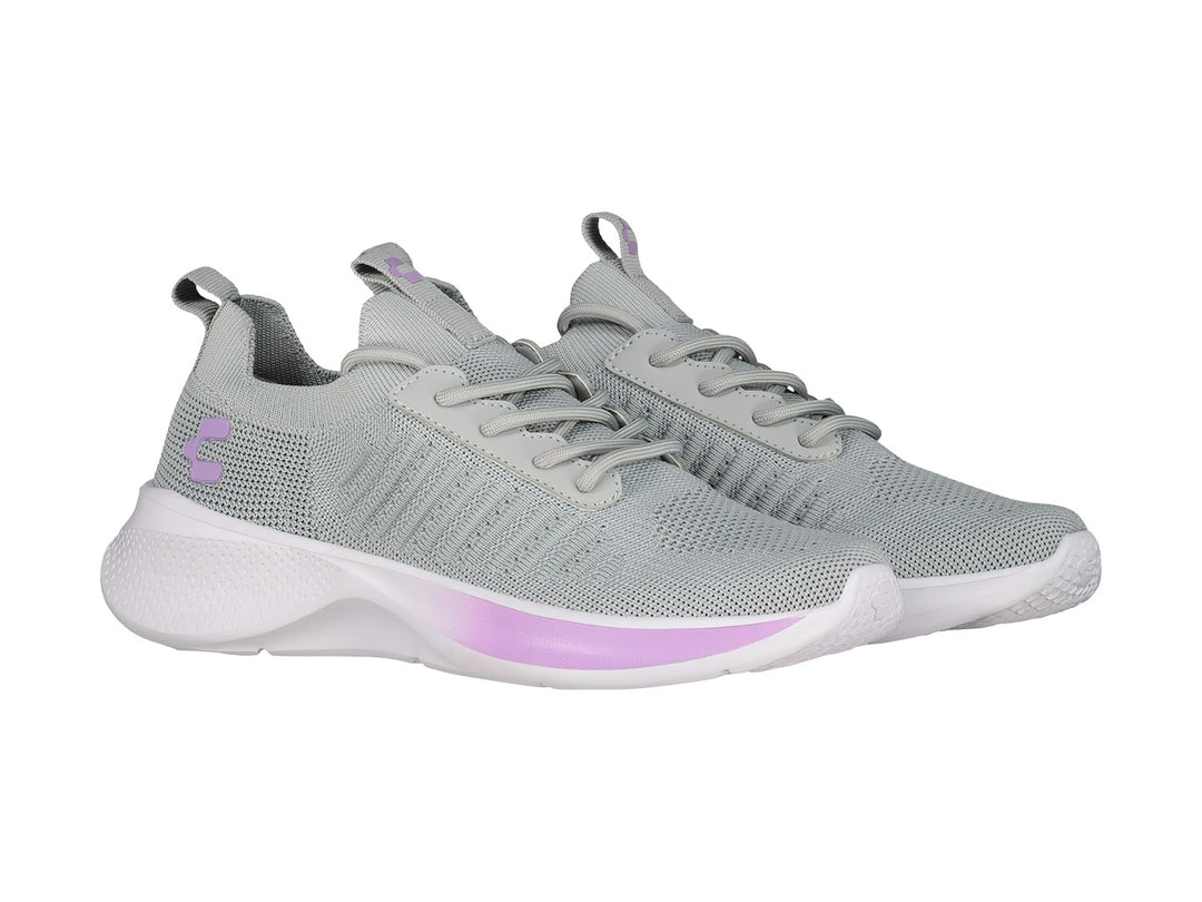 Tenis deportivos Charly color gris con detalles en lila y suela blanca.