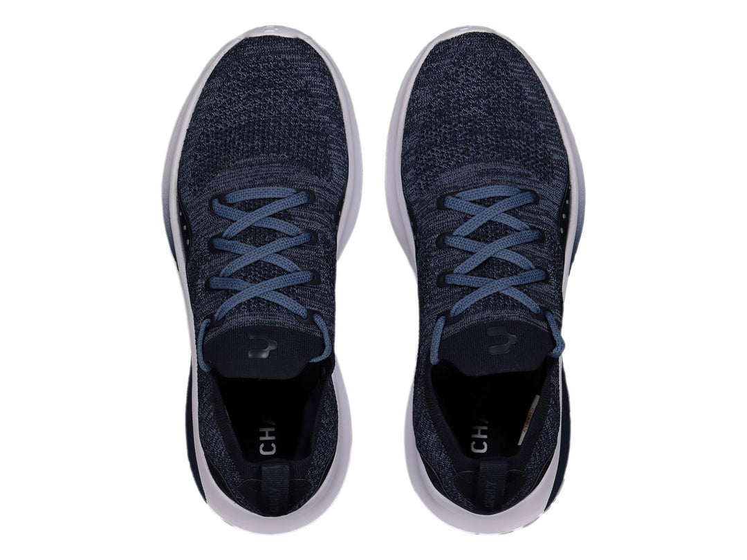 Tenis deportivos Charly color marino con suela blanca y tejido transpirable.
