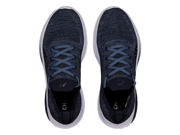 Tenis deportivos Charly color marino con suela blanca y tejido transpirable.