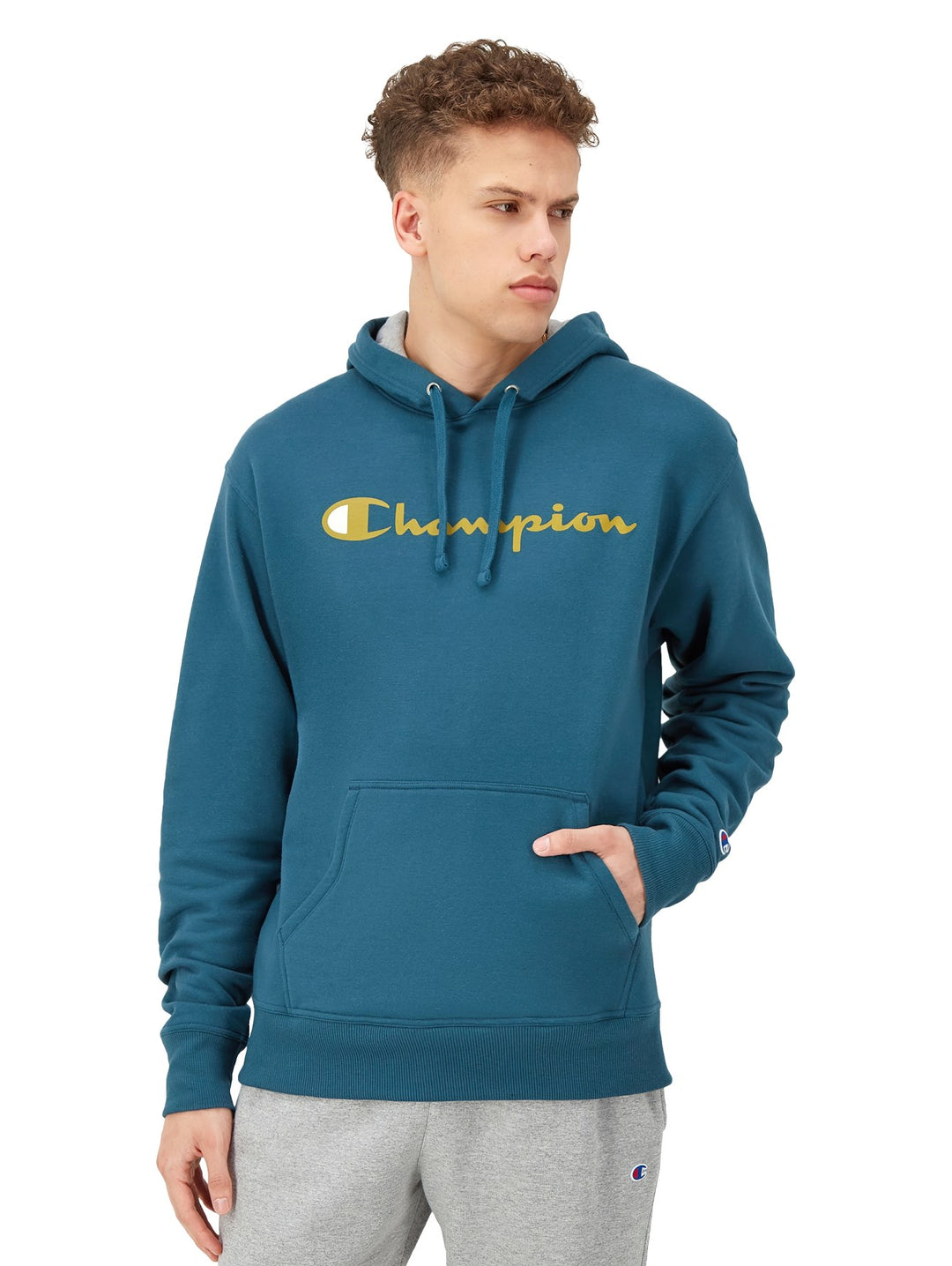 Sudadera con capucha color metallic teal con logotipo de Champion en dorado en el pecho.