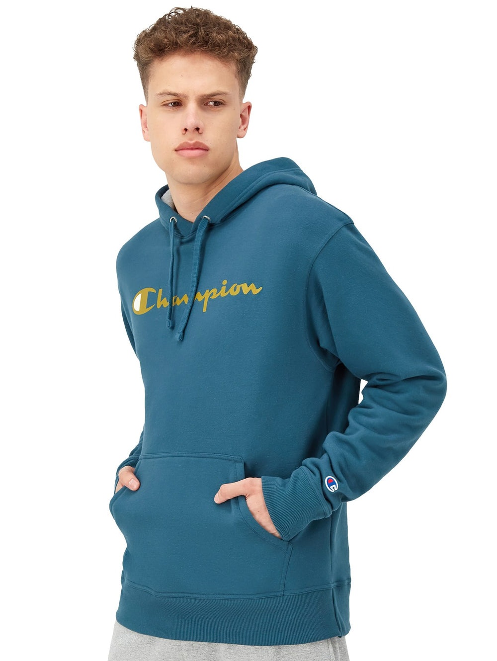 Sudadera con capucha color metallic teal con logotipo de Champion en dorado en el pecho.