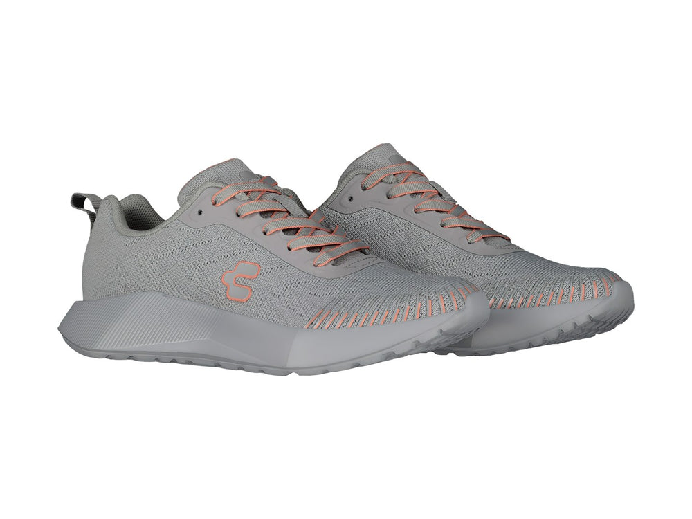 Tenis deportivos Charly color gris con detalles en coral y suela gris.