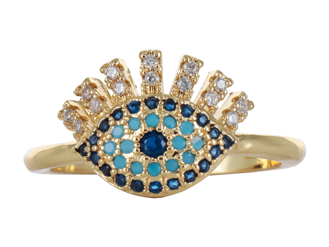 Anillo de oro con diseño de ojo turco y piedras en tonos azul y blanco.