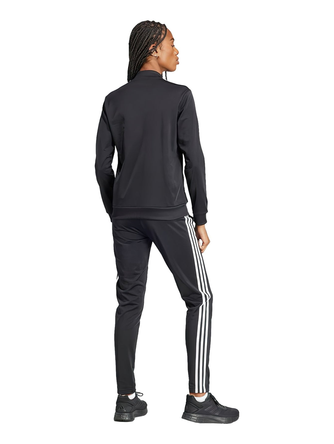 Conjunto deportivo Adidas negro con tres rayas blancas laterales, compuesto por chaqueta y pantalón.