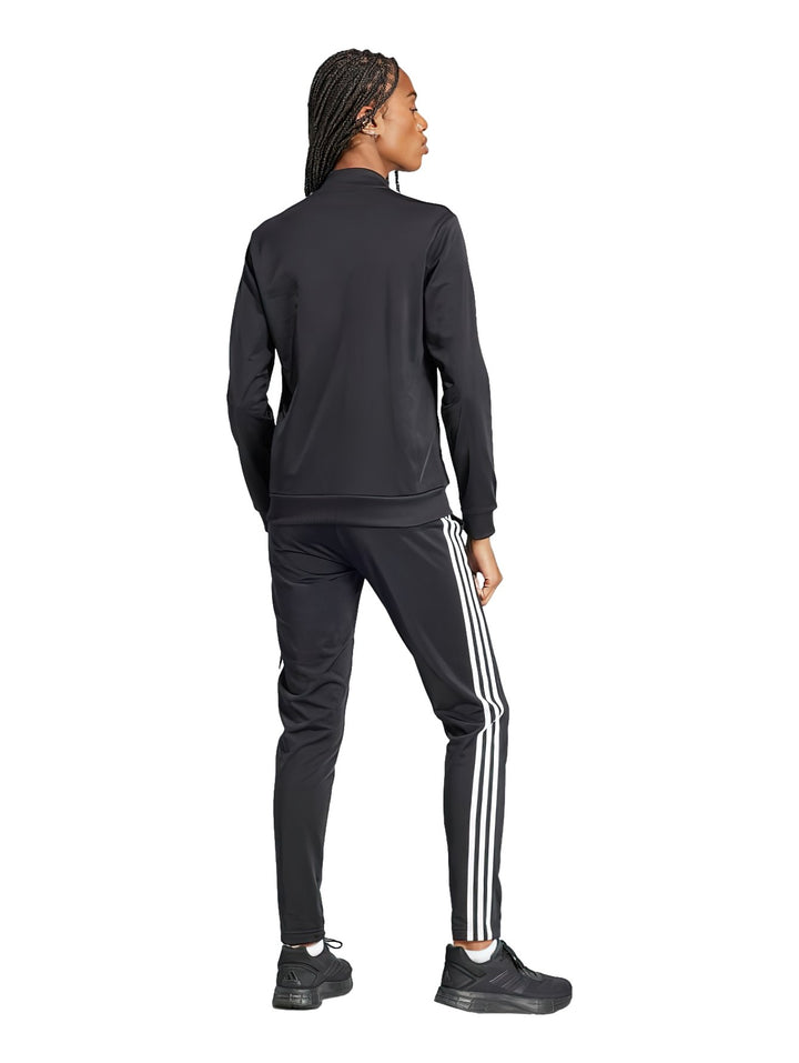Conjunto deportivo Adidas negro con tres rayas blancas laterales, compuesto por chaqueta y pantalón.