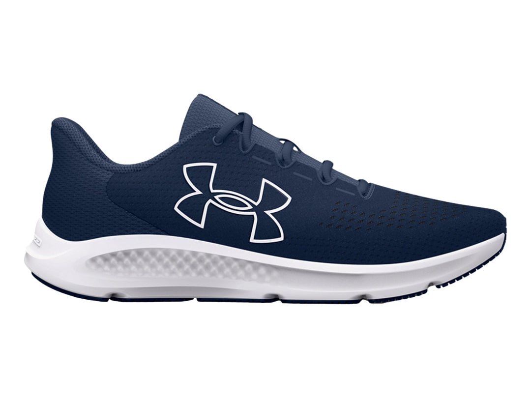 Tenis deportivos Under Armour color azul marino con suela blanca y logotipo blanco lateral.