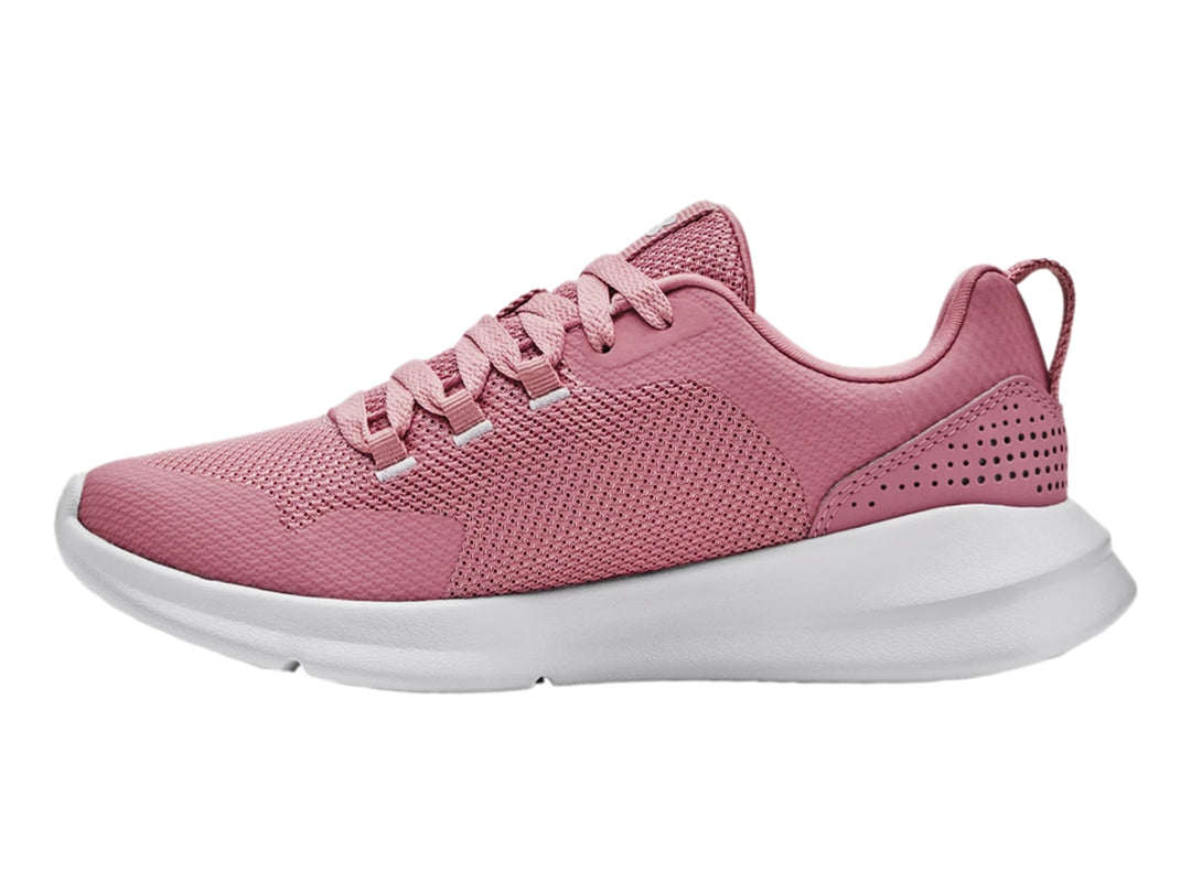 Tenis deportivos Under Armour color rosa con suela blanca.