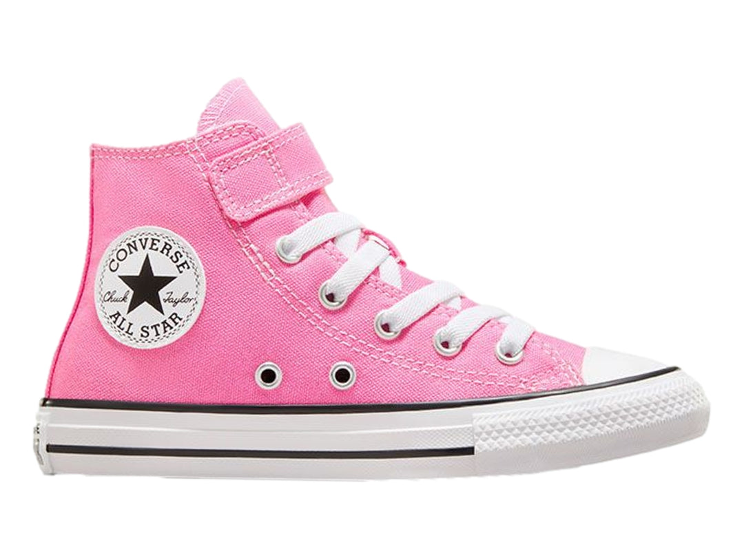 Tenis Converse Chuck Taylor All Star de color rosa para niño o niña, con cierre de velcro y agujetas blancas.