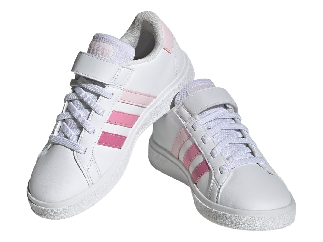 Tenis blancos Adidas Grand Court 2.0 EL K con tres franjas rosas y cierre de velcro.