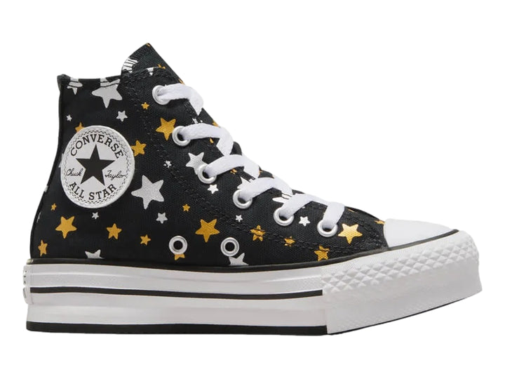 Tenis Converse Chuck Taylor All Star Platform Lift negros con estampado de estrellas doradas y plateadas.