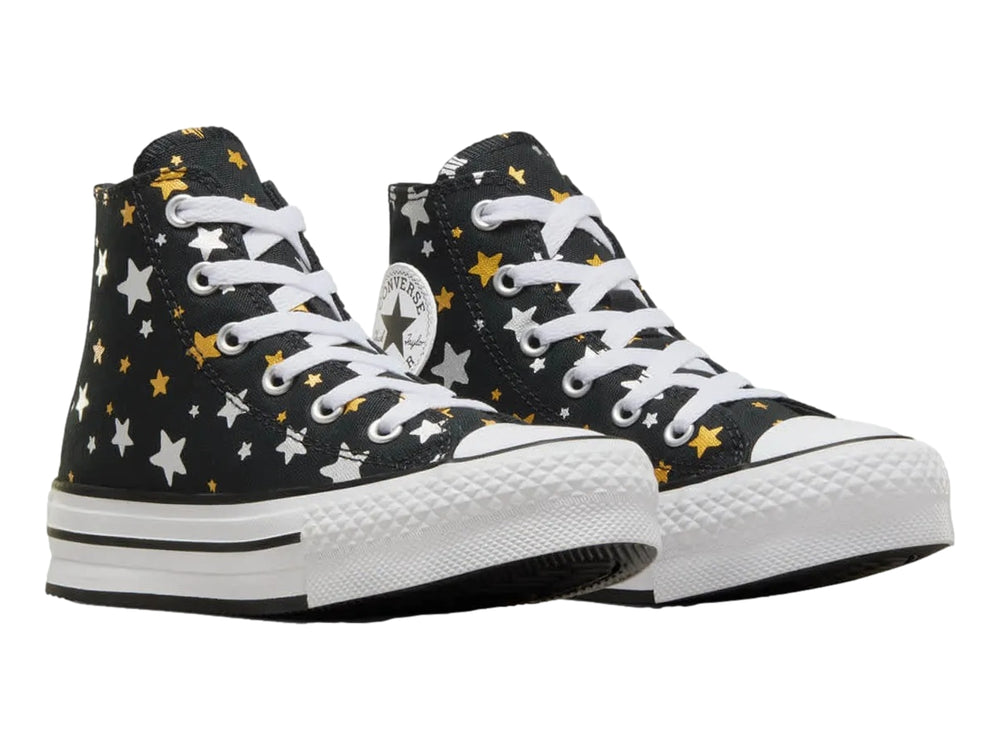 Tenis Converse Chuck Taylor All Star Platform Lift negros con estampado de estrellas doradas y plateadas.