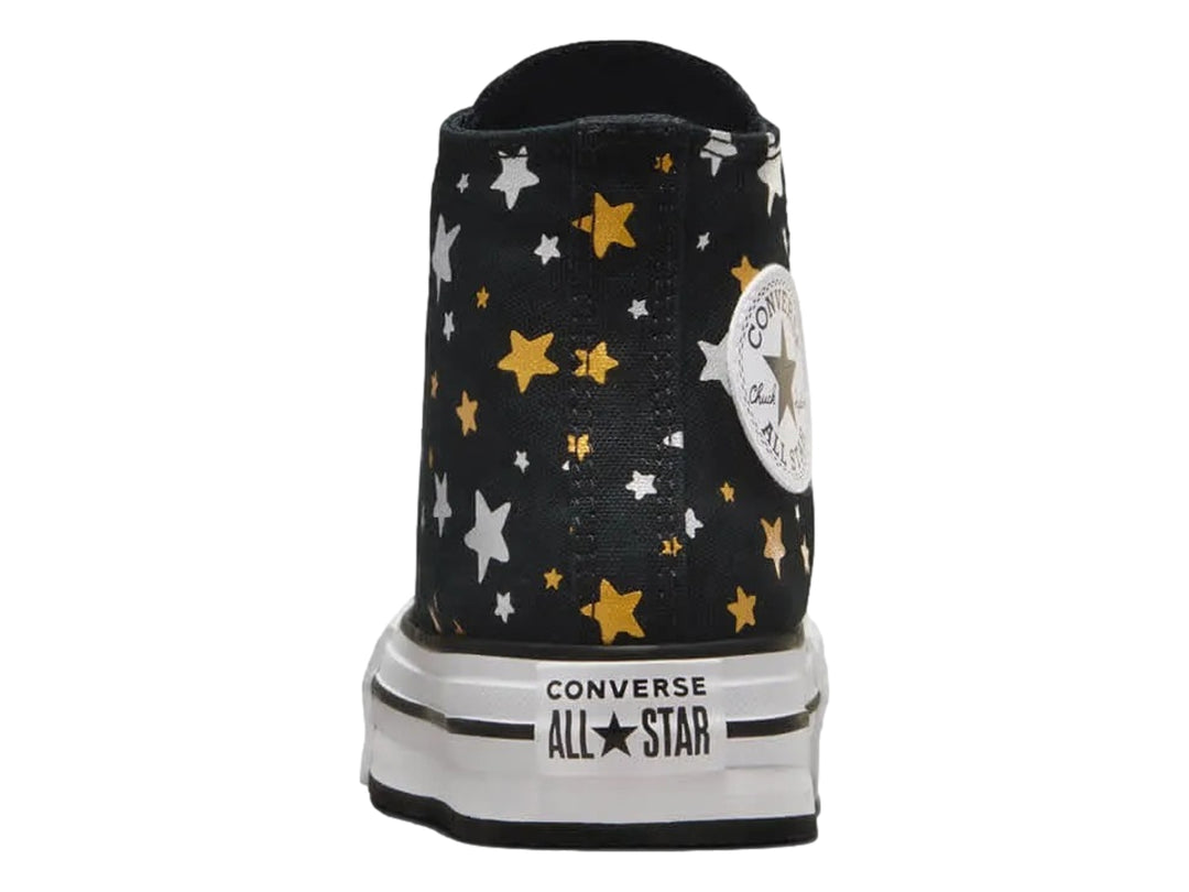Tenis Converse Chuck Taylor All Star Platform Lift negros con estampado de estrellas doradas y plateadas.