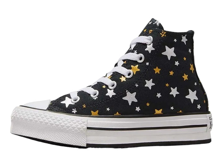 Tenis Converse Chuck Taylor All Star Platform Lift negros con estampado de estrellas doradas y plateadas.
