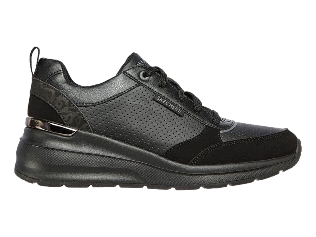 Tenis deportivos Skechers Billion en color negro con detalles perforados y suela gruesa.