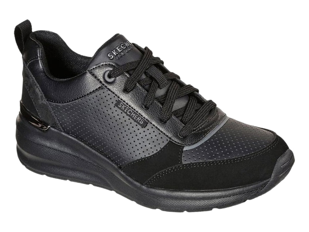 Tenis deportivos Skechers Billion en color negro con detalles perforados y suela gruesa.