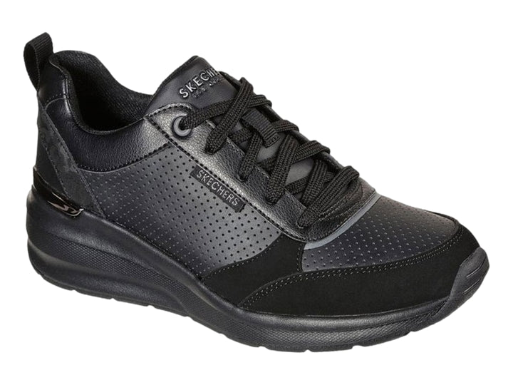 Tenis deportivos Skechers Billion en color negro con detalles perforados y suela gruesa.