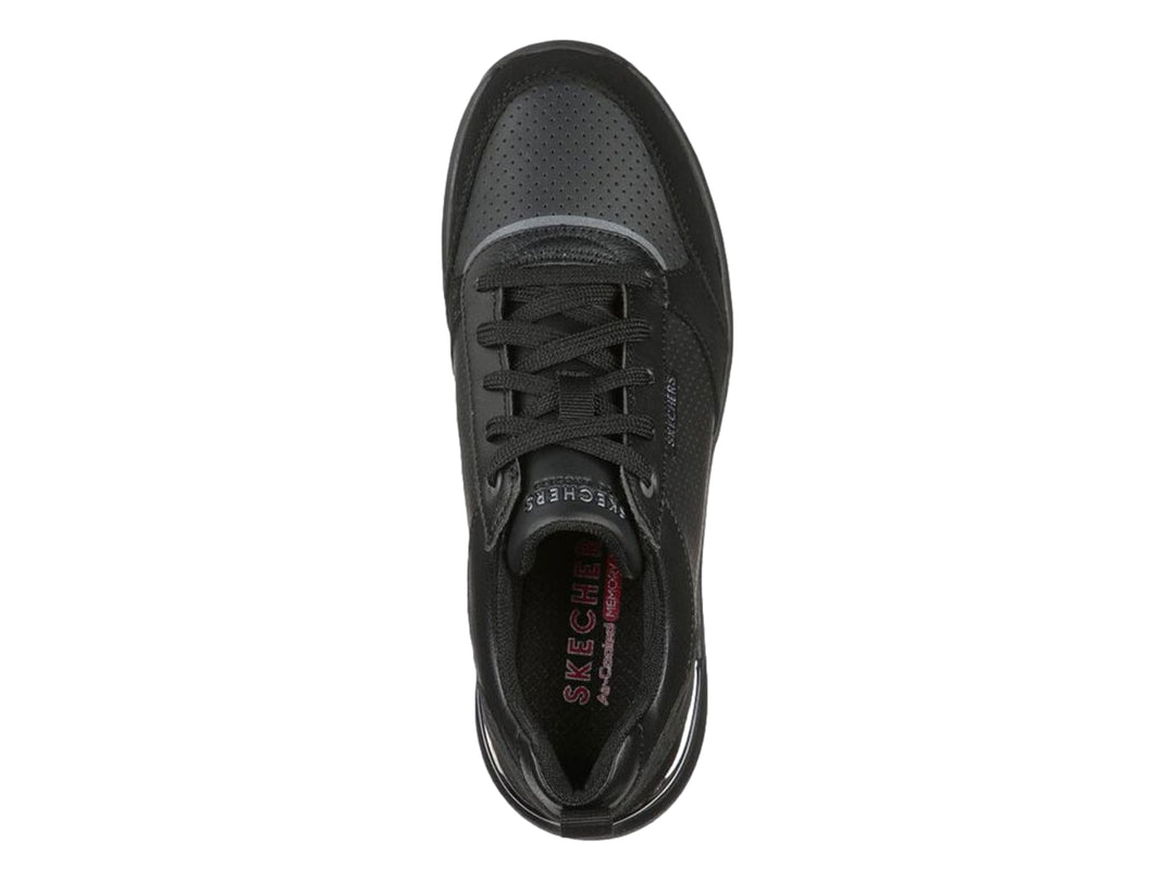 Tenis deportivos Skechers Billion en color negro con detalles perforados y suela gruesa.