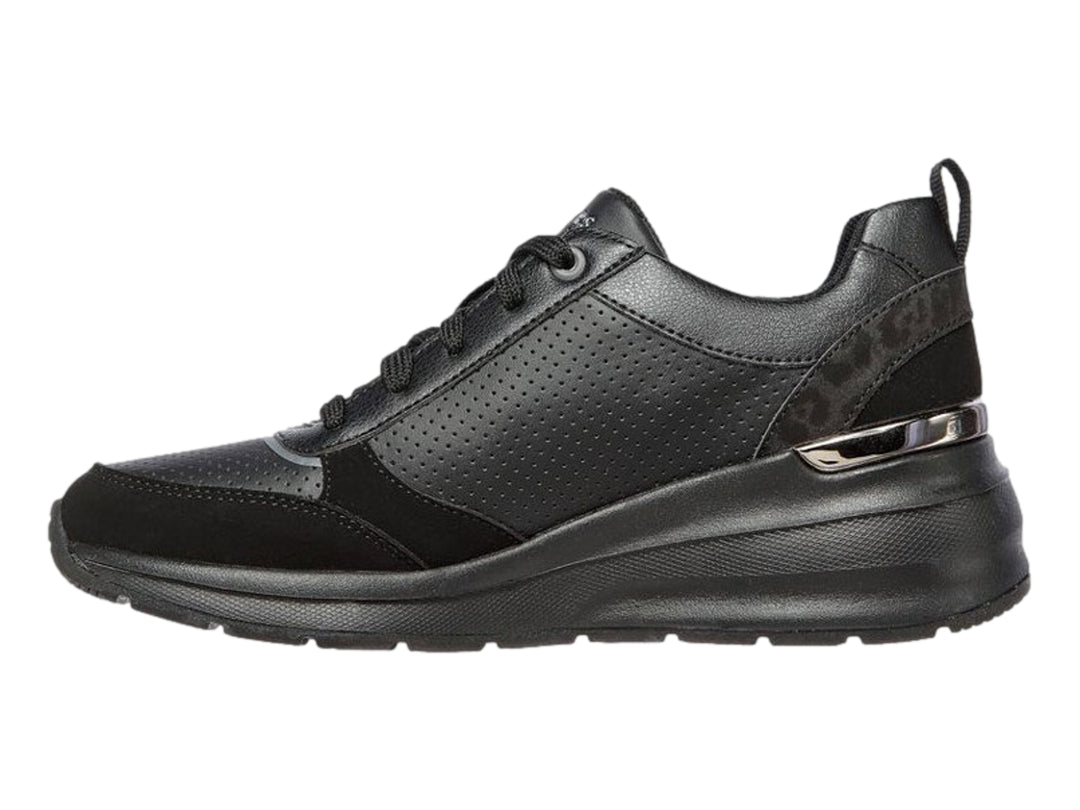 Tenis deportivos Skechers Billion en color negro con detalles perforados y suela gruesa.