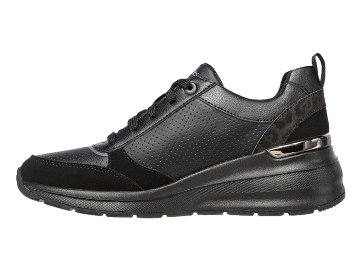Tenis deportivos Skechers Billion en color negro con detalles perforados y suela gruesa.