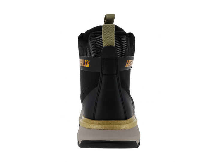 Tenis botín Caterpillar color negro con suela beige y detalles en amarillo.
